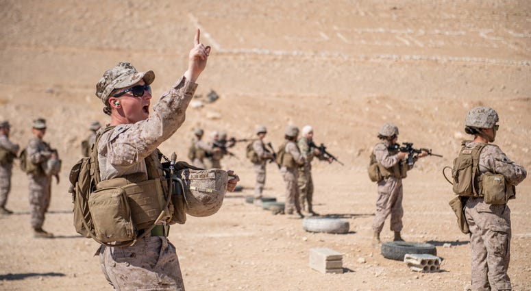 JORDAN (Aug. 1, 2019) Cpl. Riley Guidi, assigned to the 11th Marine Expeditionary Unit (MEU) Female Engagement Team, gives the course of fire to Marines and members of the Jordan Armed Forces Quick Reaction Force Female Engagement Team during a live-fire JORDAN (Aug. 1, 2019) Cpl. Riley Guidi, assigned to the 11th Marine Expeditionary Unit (MEU) Female Engagement Team, gives the course of fire to Marines and members of the Jordan Armed Forces Quick Reaction Force Female Engagement Team during a live-fire
