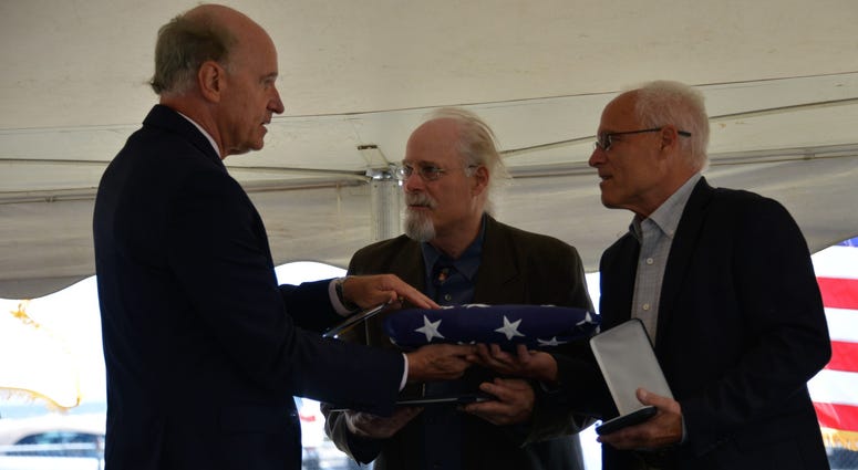 Massachusetts U.S. Representative Bill Keating presented Stephen and Bradley Finch with an American flag