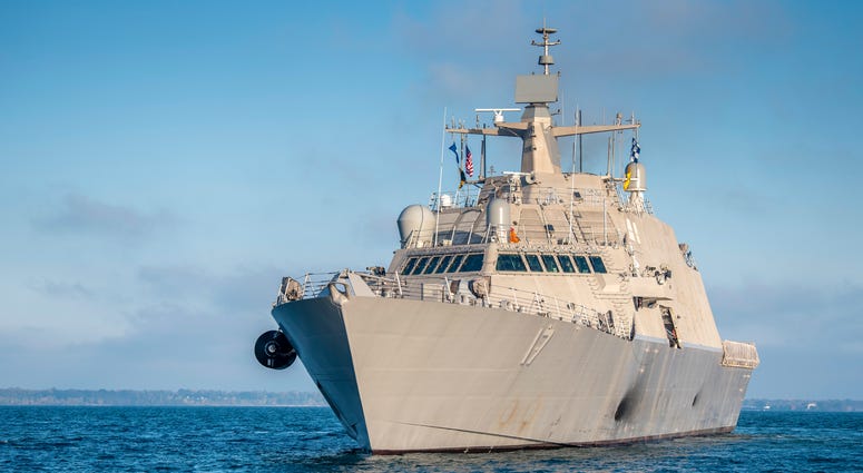 The future USS Indianapolis (LCS 17) transits Lake Michigan toward Naval Station Great Lakes for a Sail by and Salute. The Navy will commission the littoral combat ship Oct. 26, 2019 in Burns Harbor, Indiana. Naval Station Great Lakes goes on lockdown after an employee drives on base without showing credentials