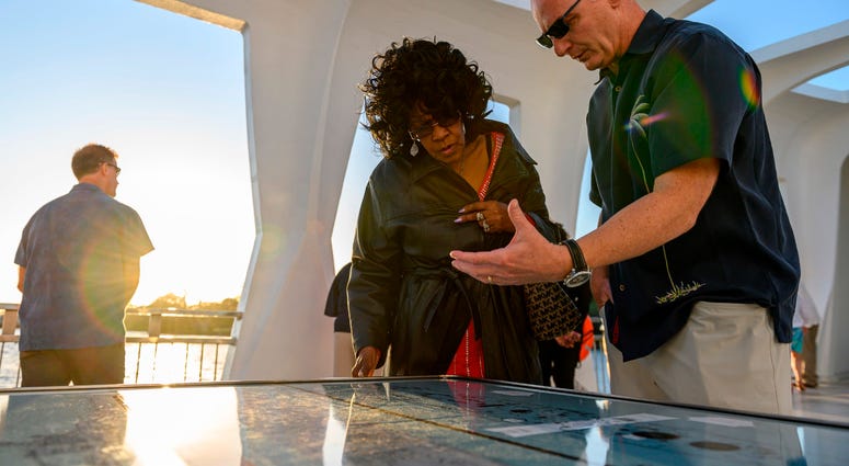 Acting Secretary of the Navy Thomas B. Modly tours the USS Arizona Memorial with Brenda Haven, niece of World War II hero Doris “Dorie” Miller