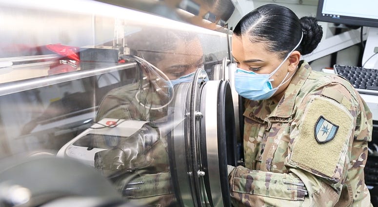 U.S. Army Spc. Crystal Gonzales conducts COVID-19 testing