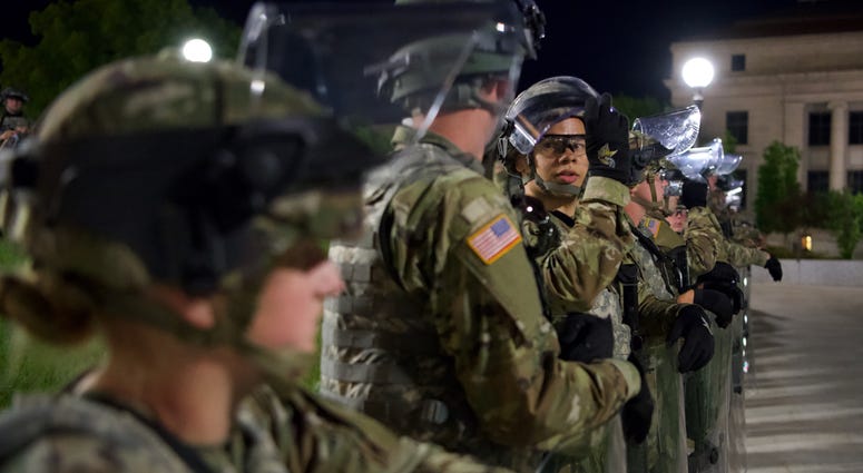 Minnesota National Guard Soldiers and Airmen stand guard overnight