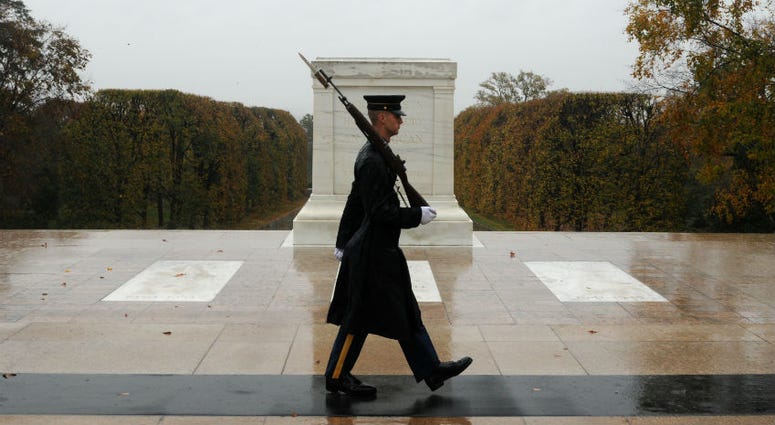 File photo of Tomb Sentinel keeping guard over the Tomb of the Unknown Soldier during Hurricane Sandy. Severe weather doesn't deter Tomb Sentinel from doing sacred duty at Tomb of the Unknown Soldier at Arlington National Cemetery.