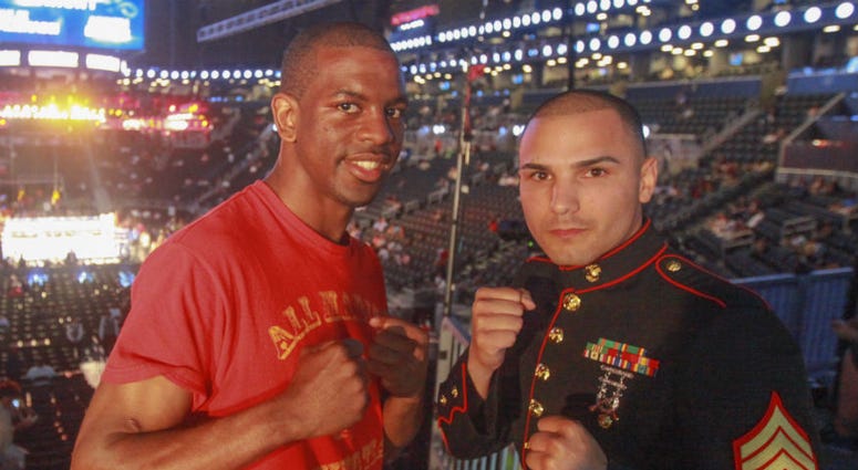 Marine Corps veteran Jamel Herring poses with former teammate Sgt. Todd DeKinderen. Marine Corps veteran Jamel Herring wins WBO junior lightweight world champion.