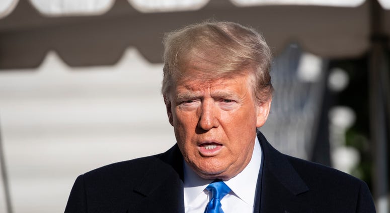 President Donald Trump speaks with reporters before boarding Marine One on the South Lawn of the White House, Saturday, Dec. 7, 2019, in Washington.