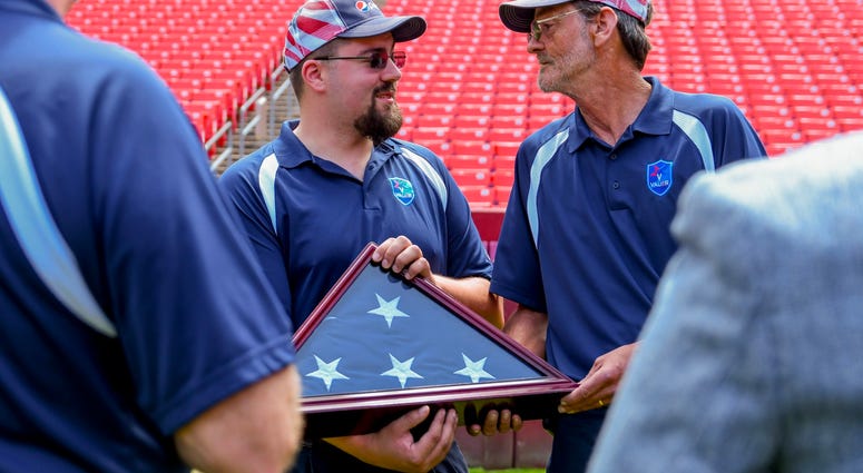 Veteran drivers pass off the flag