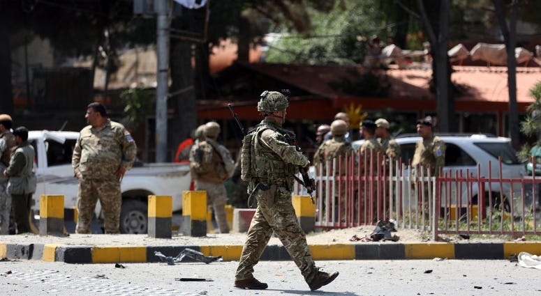 Resolute Support (RS) forces and Afghan security personnel inspect the site of a car bomb explosion in Kabul, Afghanistan, Thursday, Sept. 5, 2019. Resolute Support (RS) forces and Afghan security personnel inspect the site of a car bomb explosion in Kabul, Afghanistan, Thursday, Sept. 5, 2019.