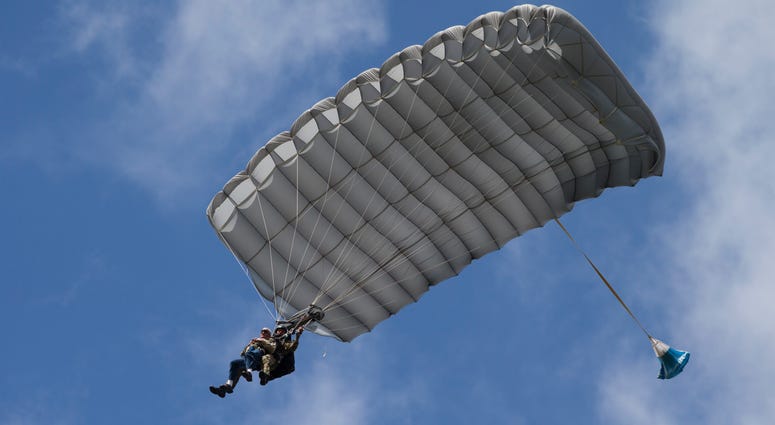 Tom Rice, a 98-year-old American WWII veteran, front left, approaches the landing zone during a tandem parachute jump near Groesbeek, Netherlands, Thursday, Sept. 19, 2019, as part of commemorations marking the 75th anniversary of Operation Market Garden. 98 year old WWII vet jumps from a plane in Europe.