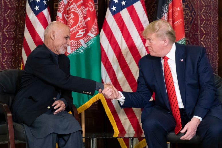 President Donald Trump shakes hands during a meeting with Afghan President Ashraf Ghani during a surprise Thanksgiving Day visit. President Donald Trump shakes hands during a meeting with Afghan President Ashraf Ghani during a surprise Thanksgiving Day visit.