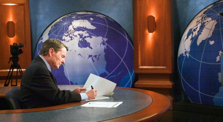 This 2004 image released by PBS shows journalist Jim Lehrer on the set of "PBS NewsHour with Jim Lehrer" in Shirlington, Va. PBS announced that Lehrer died Thursday, Jan. 23, 2020, at home. He was 85. JimLehrer