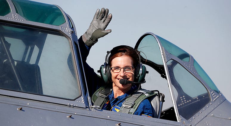 FILE - In this Jan. 12, 2018, file photo, Rep. Martha McSally, R-Ariz., leaves in a T-6 World War II airplane after speaking at a rally in Phoenix. Women with military experience _ many of them combat veterans _ are among the record number of female candi