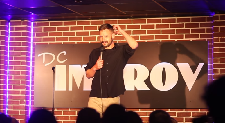 Combat-injured Marine Corps veteran Michael Garvey, who learned stand-up comedy skills in workshops presented by the Armed Services Arts Partnership, performs at a club in Washington, D. C.