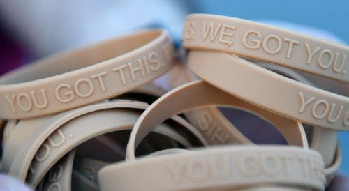Bracelets, labeled with the message, "You Got This. We Got You," are handed out to participants during the Dragon March on Keesler Air Force Base, Mississippi, Sept. 13, 2019. The three-mile walk was held as part of the wing stand down day directed by Air Bracelets, labeled with the message, "You Got This. We Got You," are handed out to participants during the Dragon March on Keesler Air Force Base, Mississippi, Sept. 13, 2019. The three-mile walk was held as part of the wing stand down day directed by Air
