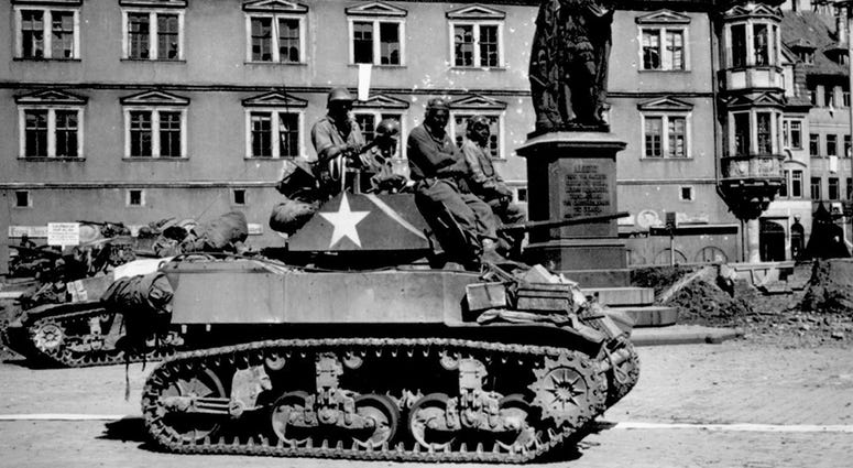 ank crews from the 761st Tank Battalion await orders to clean out scattered Nazi machine gun nests in Coburg, Germany, April 25, 1945. The 761st Tank Battalion was the first African-American tank battalion to go into battle.