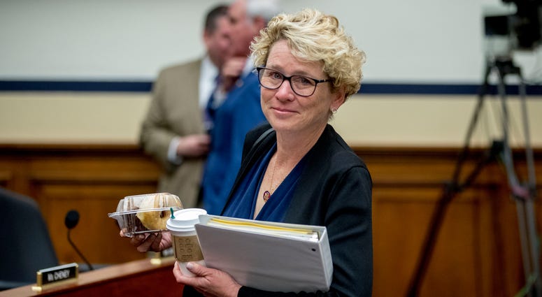 In this April 2, 2019, file photo, Rep. Chrissy Houlahan, D-Pa., arrives for a House Armed Services Committee budget hearing for the Departments of the Army and Air Force on Capitol Hill in Washington. Congresswomen with military service in their past, so