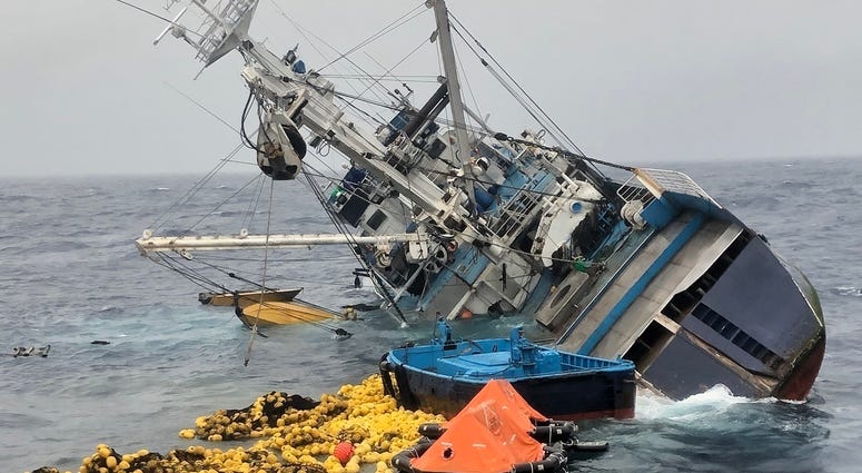 Fishing nets, life rafts, and debris from the 160-foot Ecuadorian fishing vessel Marujita float behind the capsizing vessel approximately 336 miles southeast of Clipperton Island, August 7, 2019. Twenty five crew members and 12 Coast Guardsmen who abandon Coast Guard rescues 37 people after fishing boat capsizes, sinks in the Eastern Pacific Ocean