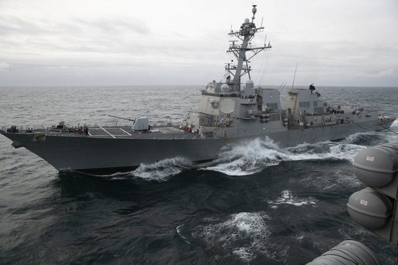 The guided-missile destroyer USS Farragut (DDG 99) conducts a replenishment-at-sea with the Nimitz-class aircraft carrier USS Harry S. Truman (CVN 75), September, 2018.