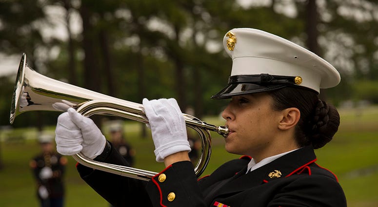 U.S. Marines, Sailors, family members and friends gather to pay their respects to Cpl. Shirley M. John (veteran) at Coastal Carolina State Veterans Cemetery, Jacksonville, NC, on April 7, 2018.
