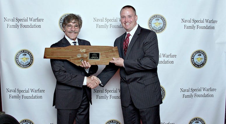Kyle Nyseth presents a custom-made plaque to Geraldo Rivera