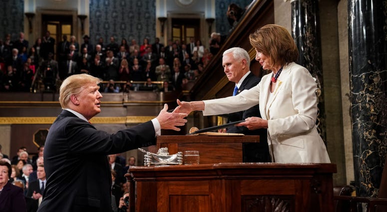 U.S. President Donald Trump shakes hands with Speaker of the House Nancy Pelosi while joined by Vice President Mike Pence before delivering the State of the Union address in the chamber of the U.S. House on Feb. 5, 2019 in Washington, D.C. PelosiTrump