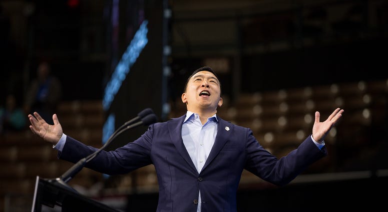 Democratic presidential candidate, entrepreneur Andrew Yang reacts as he goes on stage during the New Hampshire Democratic Party Convention