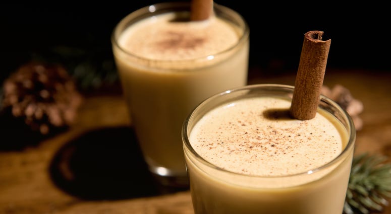 Close up of homemade traditional Christmas eggnog drinks in the glasses - stock photo