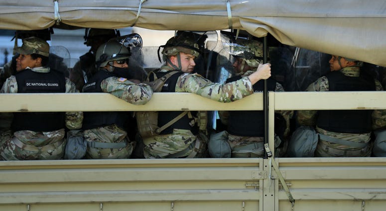 Trucks transport District of Columbia National Guard troops along West Executive Drive in support of law enforcement officers that are keeping demonstrators away from the White House June 01, 2020 in Washington, DC. Trucks transport District of Columbia National Guard troops along West Executive Drive in support of law enforcement officers that are keeping demonstrators away from the White House June 01, 2020 in Washington, DC.