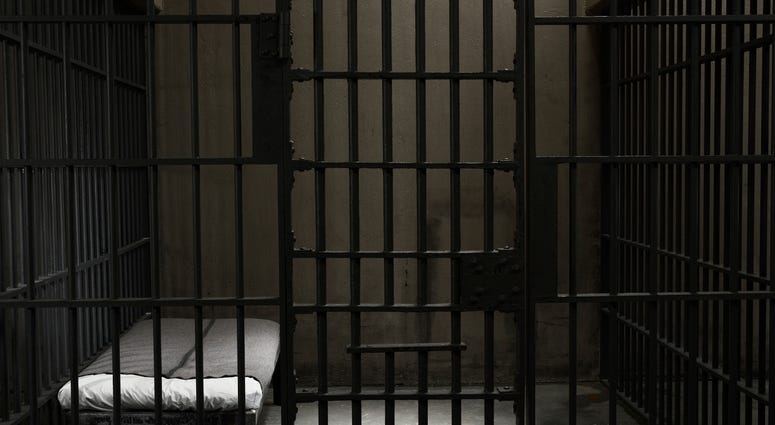 stock photo prison cell inside of a stark prison cell