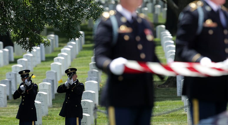 ARLINGTON, VIRGINIA - JUNE 06: Members of a firing party fire shots during the funeral of World War II Army veteran Carl Mann on the 75th anniversary of the D-Day invasion June 6, 2019 at Arlington National Cemetery in Arlington, Virginia. Mann, a native VA cemetery expansion behind schedule according to GAO report
