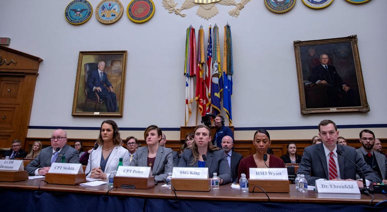 WASHINGTON, DC - FEBRUARY 27: Navy Lt. Commander Blake Dremann, Army Capt. Alivia Stehlik, Army Capt. Jennifer Peace, Army Staff Sgt. Patricia King, Navy Petty Officer 3rd Class Akira Wyatt, and Dr. Jesse M. Ehrenfeld, chair-elect of the American Medical House Armed Services Committee Holds Hearing On Transgender Troops In The Military