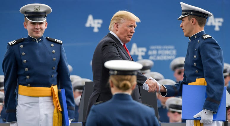 COLORADO SPRINGS, CO - MAY 30: President Donald Trump shakes hands with a cadet during the presentation of diplomas at the United States Air Force Academy graduation ceremony on May 30, 2019 in Colorado Springs, Colorado. President Trump Delivers Remarks At US Air Force Academy Graduation Ceremony