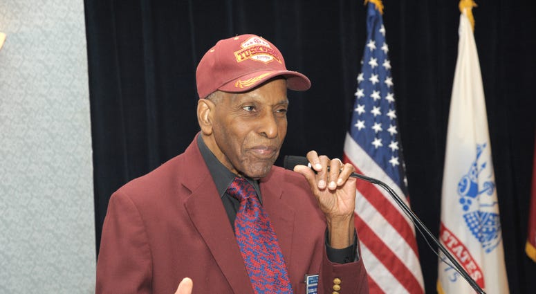 Dr. Granville Coggs, a Tuskegee Airman, recites a poem written by Dr. Martin Luther King Jr. Jan. 16 at the Dr. Martin Luther King Jr. 2014 Observance Luncheon at Joint Base San Antonio-Randolph Parr Club. Tuskegee Airman Dr. Granville Coggs
