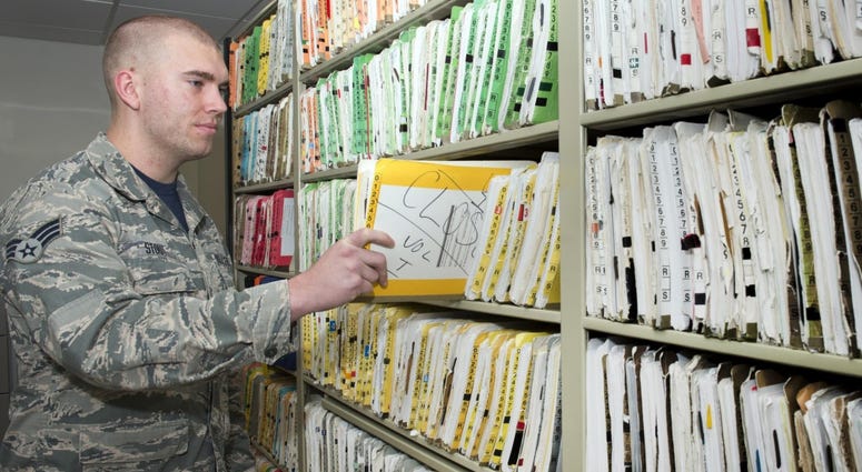 Senior Airman Devon Stout, 66th Medical Squadron health care management technician, completes a quality check of an outpatient medical record at the clinic Oct. 20. Healthrecords