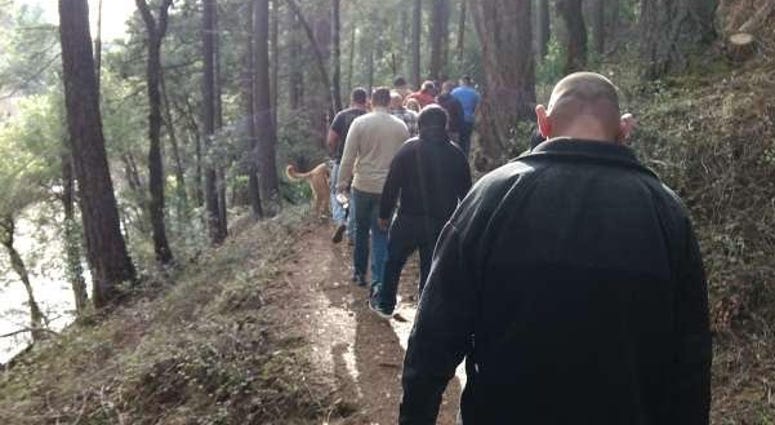 Marines hike during a reunion weekend. Marine reunion