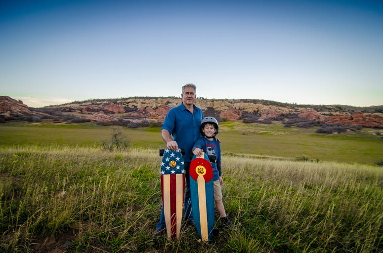 Mike Maloney (left) is the Founder of KOTA Longboards Retired Navy fighter pilot Mike Maloney founder of KOTA Longboards