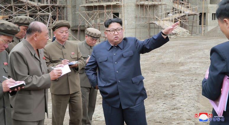 hoto provided by Korean Central News Agency (KCNA) on July 10, 2018 shows Kim Jong Un (C), top leader of the Democratic People's Republic of Korea (DPRK).