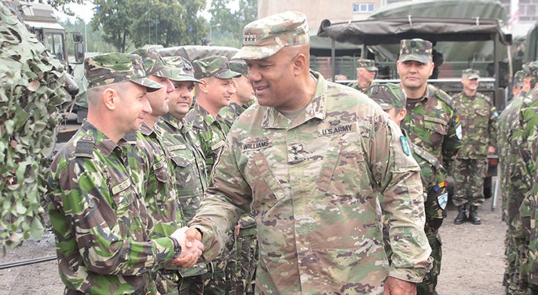 Lt. Gen. Darryl Williams, NATO LANDCOM Commander, meets with Battle Group Poland Romanian Soldiers at the Bemowo Piskie Training Area August 21. The U.S.-led NATO Battle Group, including U.K. and Romanian soldiers, arrived as a deterrence force in northea