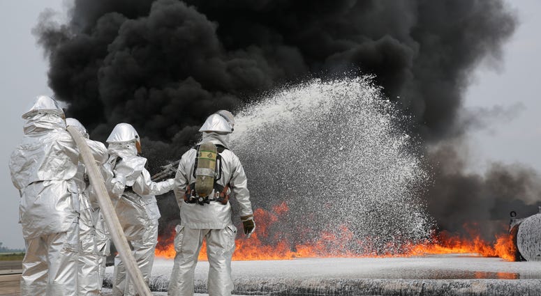 Marines with Bulk Fuel Company, 8th Engineer Support Battalion, 2nd Marine Logistics Group use Twin Agent Units to extinguish a blaze during a live fire training exercise aboard Marine Corps Air Station Cherry Point, Aug. 28, 2013. TAUs combine dry chemic Marines with Bulk Fuel Company, 8th Engineer Support Battalion, 2nd Marine Logistics Group use Twin Agent Units to extinguish a blaze during a live fire training exercise aboard Marine Corps Air Station Cherry Point, Aug. 28, 2013. TAUs combine dry chemic