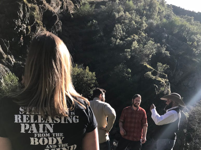 Shauna Springer, David Bachmann and Marines gather during a reunion hike. Reunion5