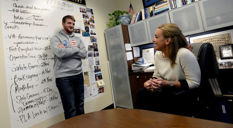 Middle Tennessee State University Veterans and Military Family Center director, Dr. Hilary Miller talks with geo science student and former United State Marine Corps Sgt. Brandon Watts, 25.