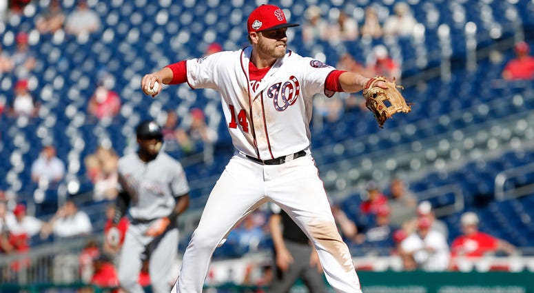 Washington Nationals relief pitcher Mark Reynolds (14) pitches against the Miami Marlins n the ninth inning at Nationals Park.