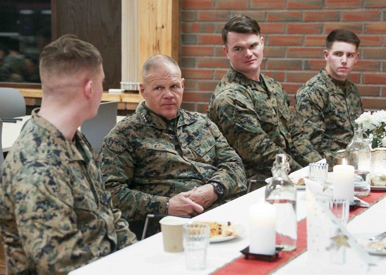 Commandant of the Marine Corps Gen. Robert B. Neller eats with Marines in Vaernes, Norway, Dec. 20, 2018.