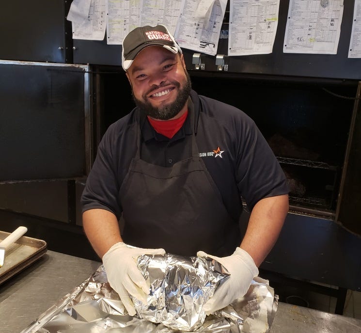 A veteran team member working at Mission BBQ's Oviedo, FL location.