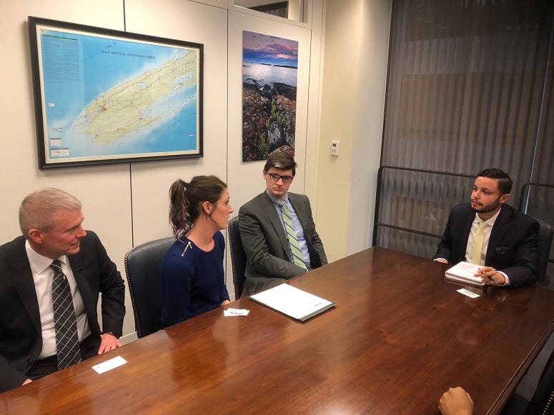 Army veteran Shannon Adams (L), Marine Corps veteran Hether Zeckser, and IAVA legislative associate Travis Horr meets with the staff of Sen. Gary Peters (D-Mich.) on Dec. 12, 2018