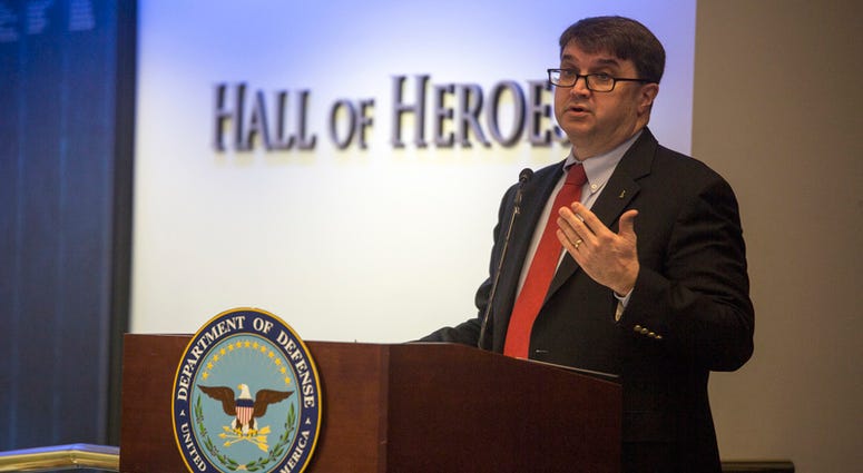 Honorable Robert Wilkie, Under Secretary of Defense for Personnel and Readiness, speaks to a gathering of service members from each military branch about the importance of family readiness at the 2017 Department of Defense Family Readiness Award.