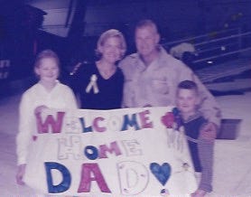 Brig. Gen. Mike Heston's family welcomes him home from deployment. Heston2