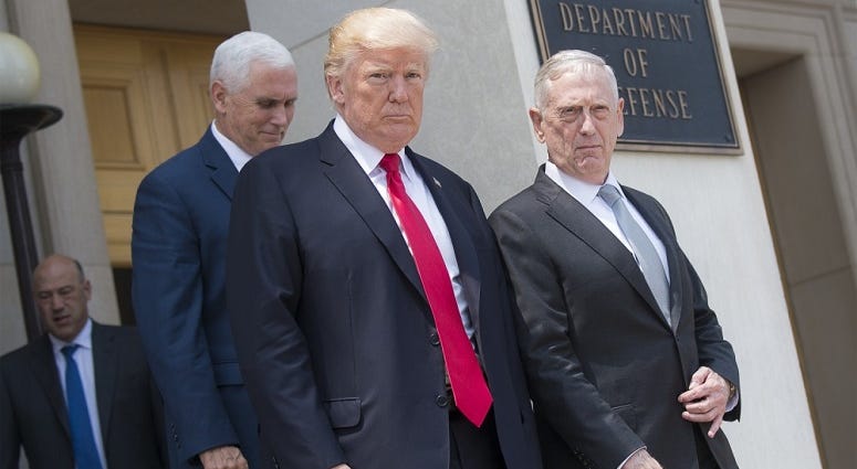 Secretary of Defense Jim Mattis speaks to President Donald Trump and Vice President Mike Pence July 20, 2017, at the Pentagon in Washington, D.C., following a meeting of the National Security Council.