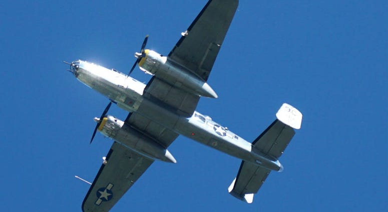A WWII-era B-25 Mitchell bomber takes the first of a few passes overhead of Northville, MI. Memorial Day weekend across America.