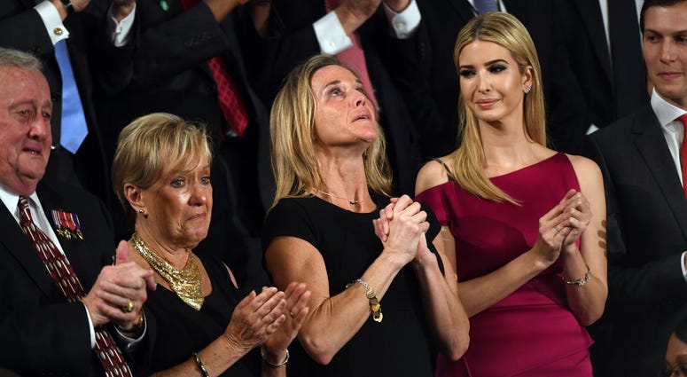 Carryn Owens, the widow of U.S. Navy Special Operator Senior Chief William "Ryan" Owens stands after being acknowledged by President Donald Trump during his address to a joint session of Congress at the U.S. Capitol Feb. 28, 2017.