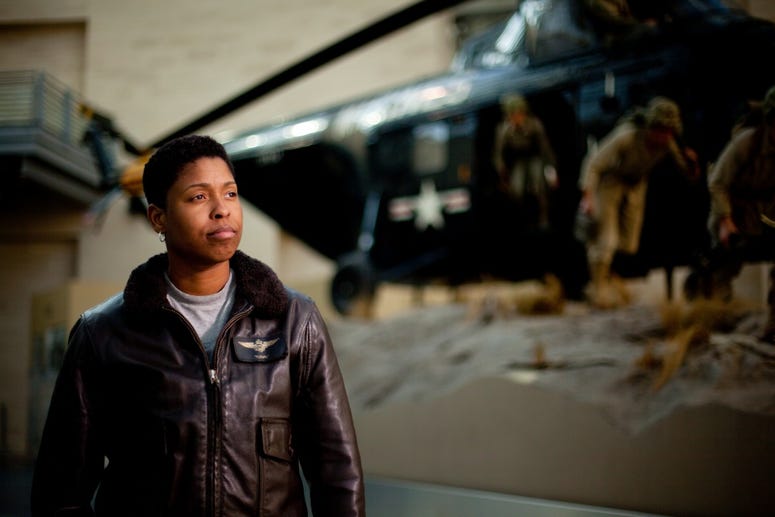 Capt. Vernice Armour stands in front of an exhibit at the National Museum of the Marine Corps